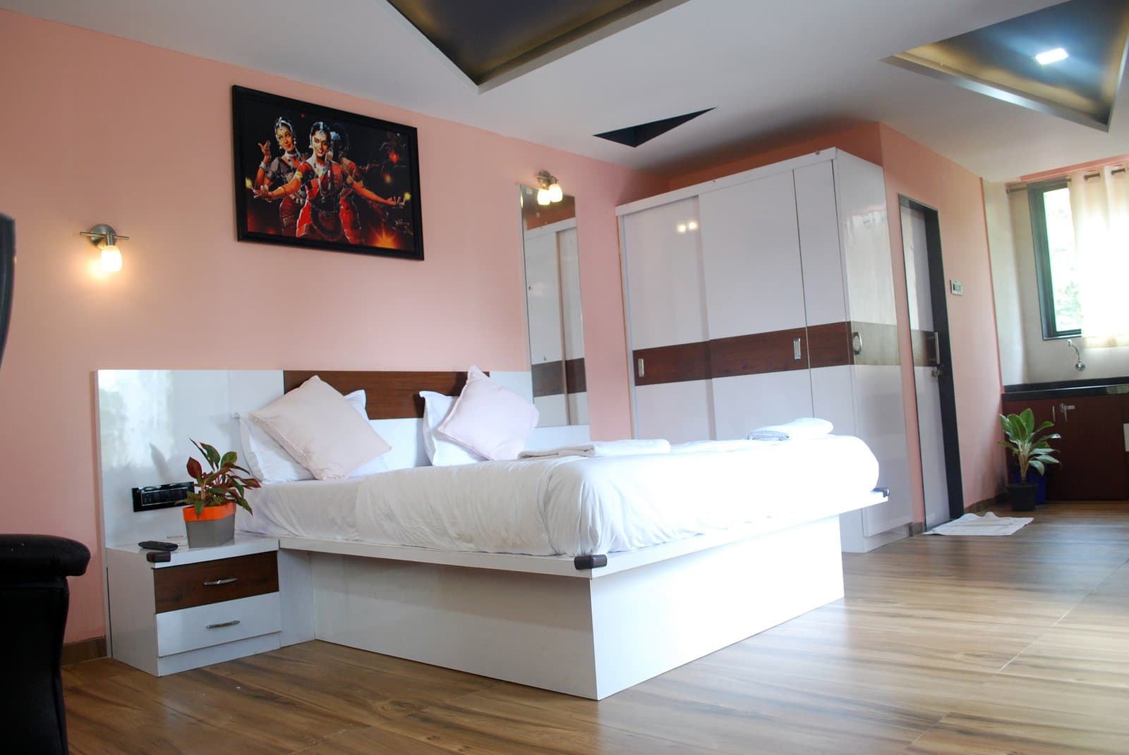 Premium Room with Balcony at Palolem Heights — bed, kitchenette and dining corner